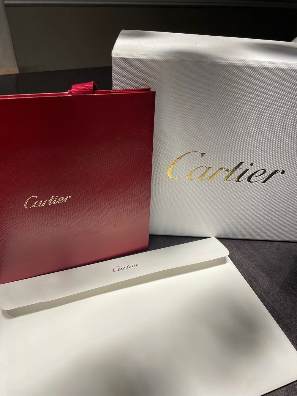 Cartier Storage Box, envelope, shopping bag and ribbon.